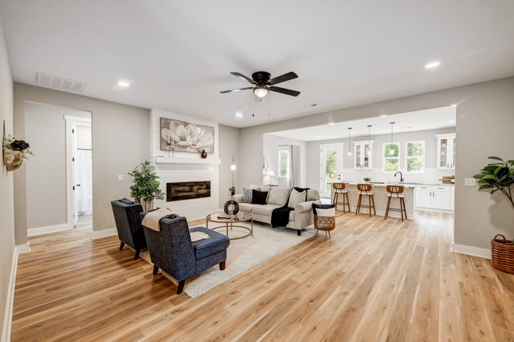 Bright modern open-plan living room and kitchen with stylish furniture