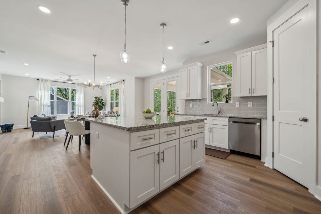 Spacious modern kitchen and living area with natural light and sleek design