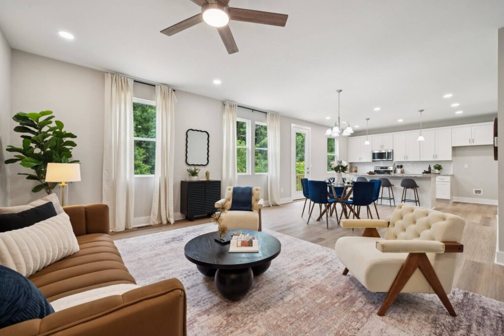 Modern open-concept living room, dining area, and kitchen with contemporary design